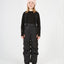 XTM Kids Pluto II Snow Pant in Black, front view on a child with braces over a black top