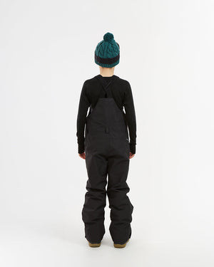XTM Kids Bailey Ski Pant in Black, back view on a child showing the crossed straps