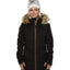 Woman wearing the black XTM Courcheval snow jacket, long quilted cut with faux fur trimmed hood