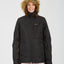 Woman in the black XTM Province ski jacket with the faux fur hood up, front view
