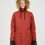 Woman in the Spice red XTM Ryker snow jacket with the faux fur hood up, front view