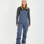 XTM Harper II women's bib overalls in Indigo, full-length front view with cargo pocket