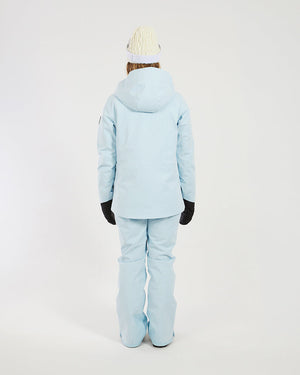 Back view of the Sky Blue XTM Elevation II women's ski jacket worn with matching pants