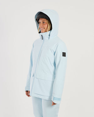 Woman wearing the Sky Blue XTM Elevation II with the hood up, three-quarter view