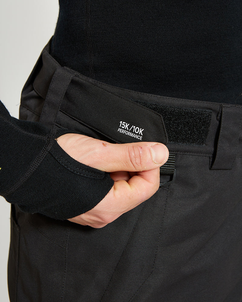 Close-up of the velcro external waist adjuster on the Black XTM Glide ski pant