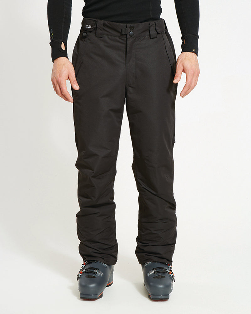 XTM Glide men's ski pant in Black, front view worn with ski boots