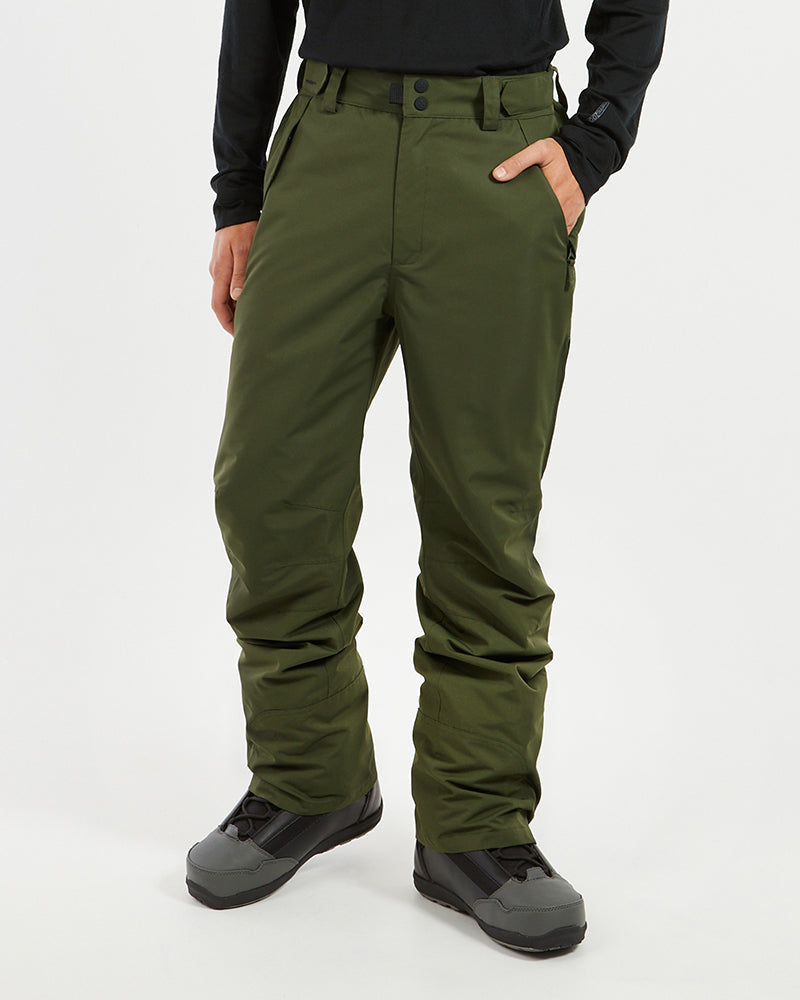 XTM Glide men's ski pant in Evergreen, front view with a hand in the pocket