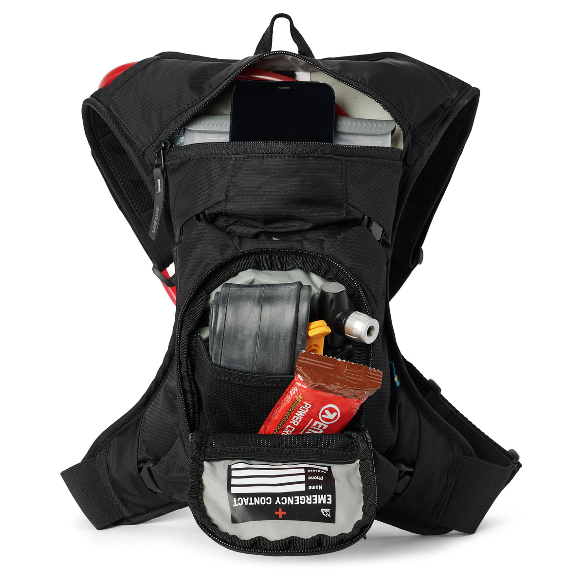 USWE MTB Hydro 3L in Black with pockets open, holding a phone, spare tube, energy bar and emergency contact card