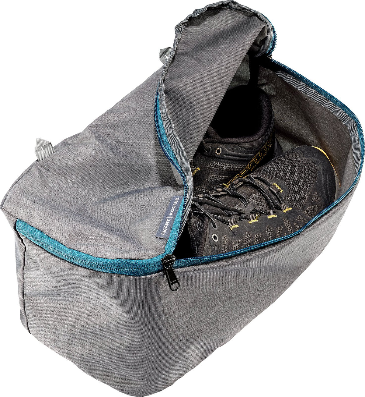 Grey shoe compartment of the Deuter Access 55 with blue zip trim, holding walking shoes