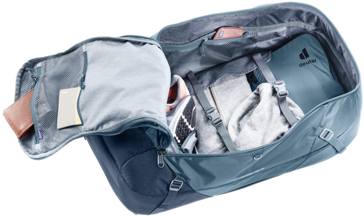 Deuter Access Pro 65 in Atlantic Ink opened through the front zip, showing packed clothes inside