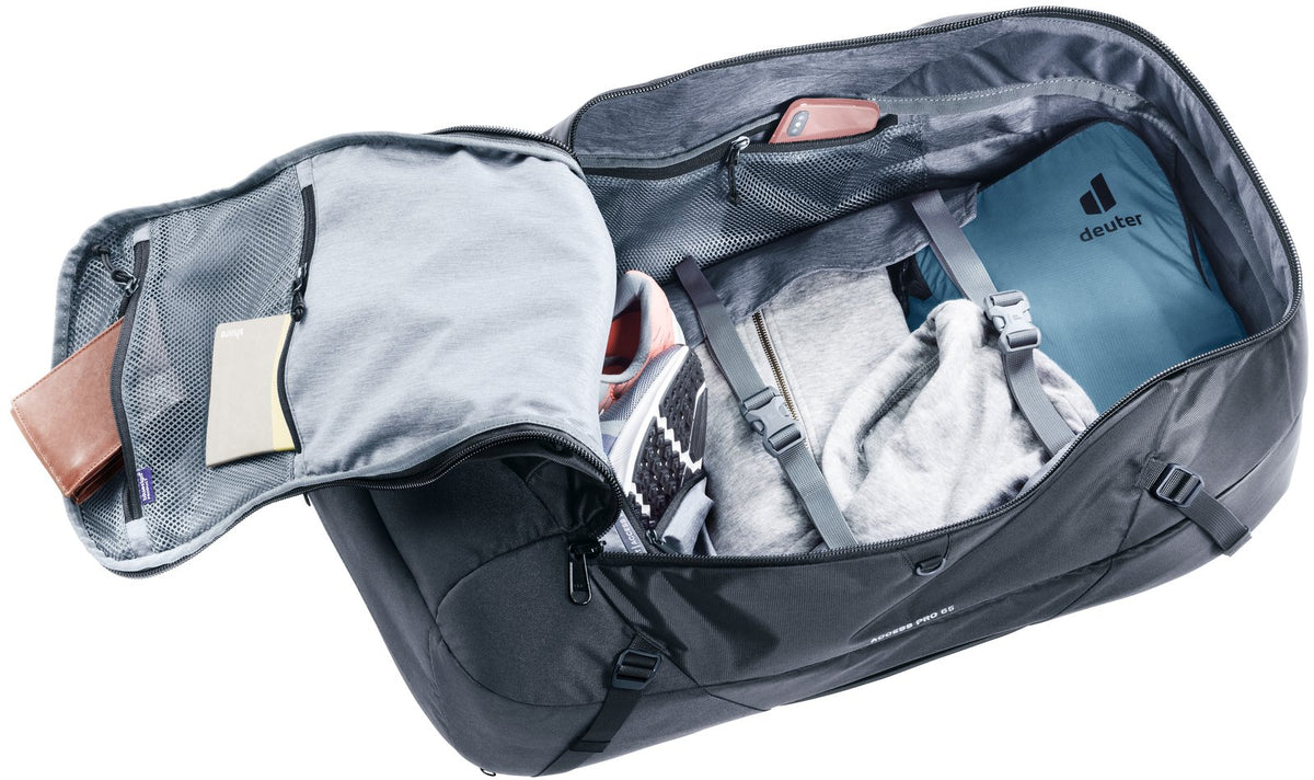 Deuter Access Pro 65 in Black opened flat like a suitcase, packed with clothes and the shoe bag