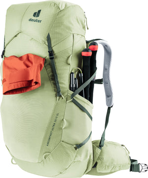 Deuter Aircontact Ultra 35+5 SL with a jacket in the front pocket and poles in the side pocket