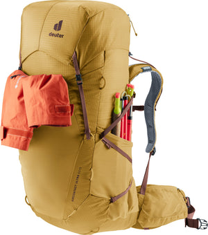 Deuter Aircontact Ultra 50+5 with a rain jacket held under the gear straps and gear in the side pocket