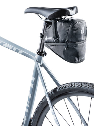 Deuter Bike Bag 1.1 + 0.3 under a bike saddle with the 0.3 L expansion unzipped