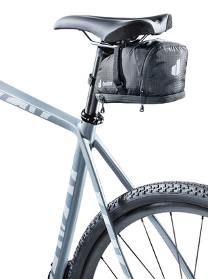 Deuter Bike Bag 1.1 + 0.3 in black mounted under the saddle of a grey gravel bike