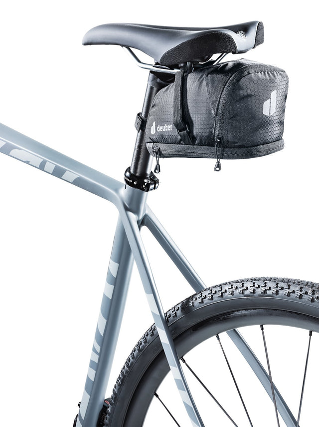 Deuter Bike Bag 1.1 + 0.3 in black mounted under the saddle of a grey gravel bike
