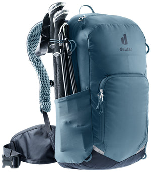 Deuter Bike I 20 in Atlantic Ink with trekking poles stowed on the side