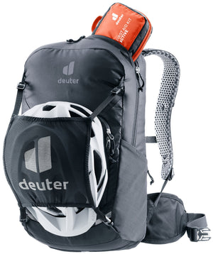Deuter Bike I 20 in Black carrying a bike helmet in the detachable mesh helmet holder