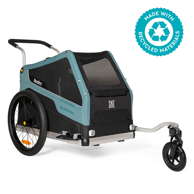Burley Bark Ranger dog trailer in blue-grey and black, front three-quarter view with stroller wheel fitted