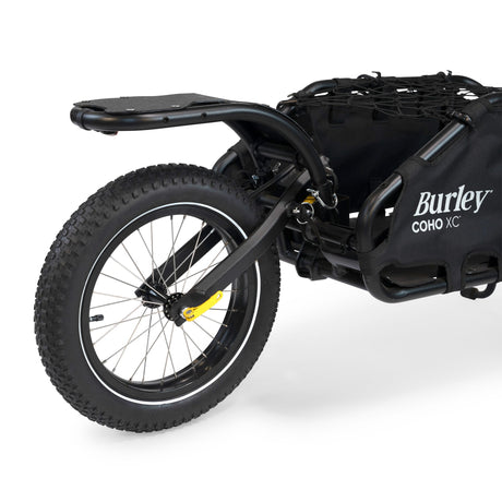 Burley Coho 16+ Wheel Kit fitted to the rear of a black Burley Coho XC cargo trailer with cargo net