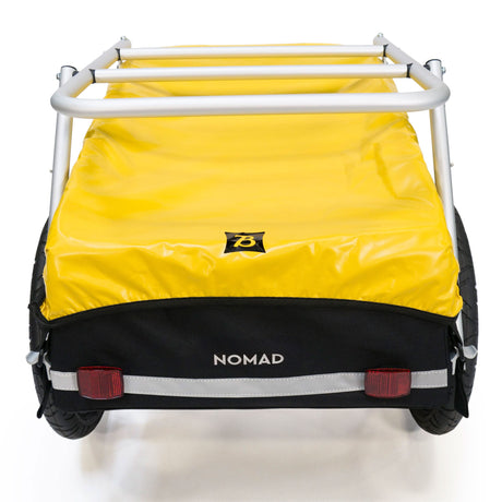 Burley Nomad Cargo Rack fitted over a Nomad trailer with yellow cover, seen from the rear