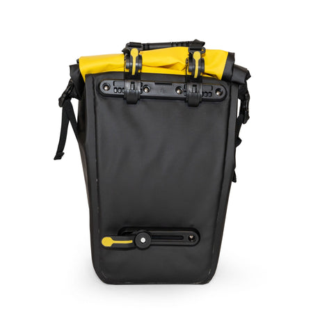 Back of a Burley pannier showing the black mounting hooks and lower rack clip