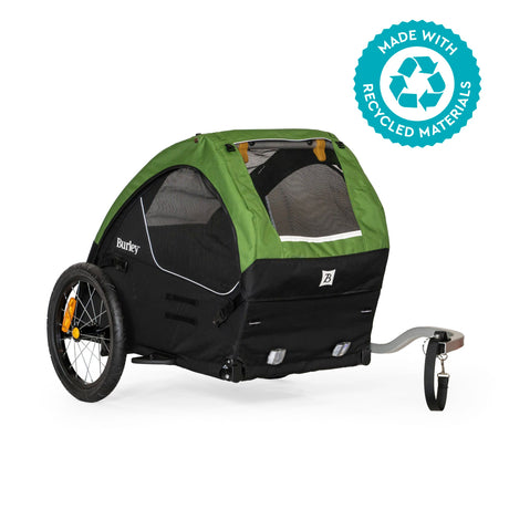 Burley Tail Wagon dog bike trailer in green and black, front three-quarter view with tow bar and mesh windows