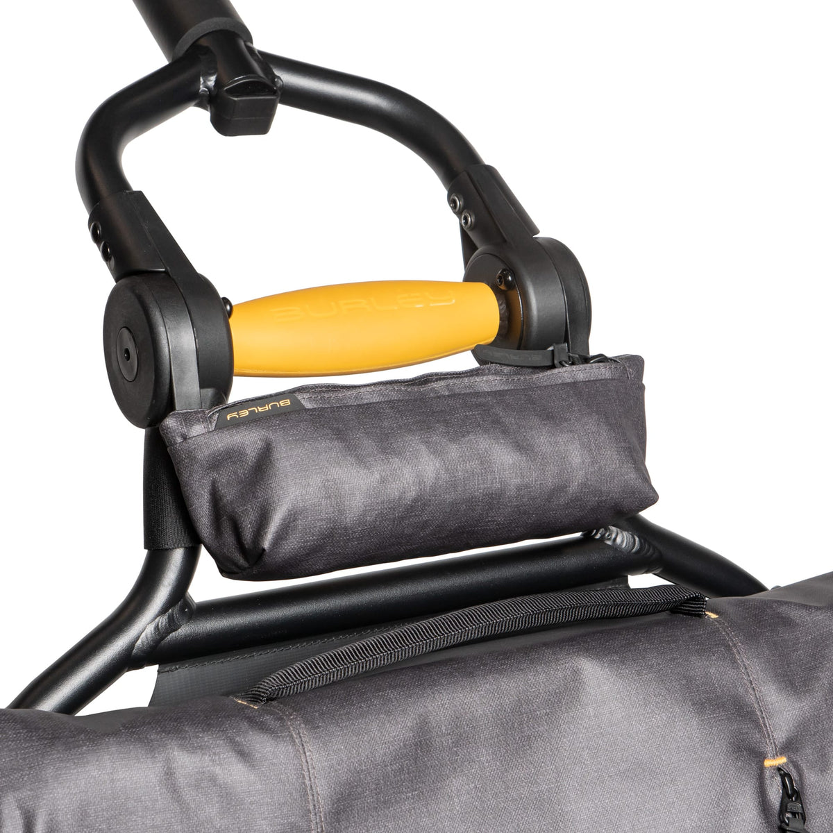 Burley Travoy Rain Cover storage sack mounted on the Travoy frame just below the yellow handle
