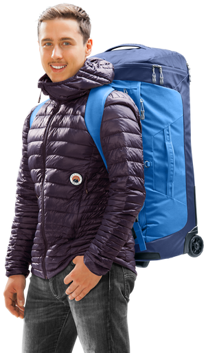 Traveller carrying the Deuter Duffel Pro Movo 60 on his back with the shoulder straps