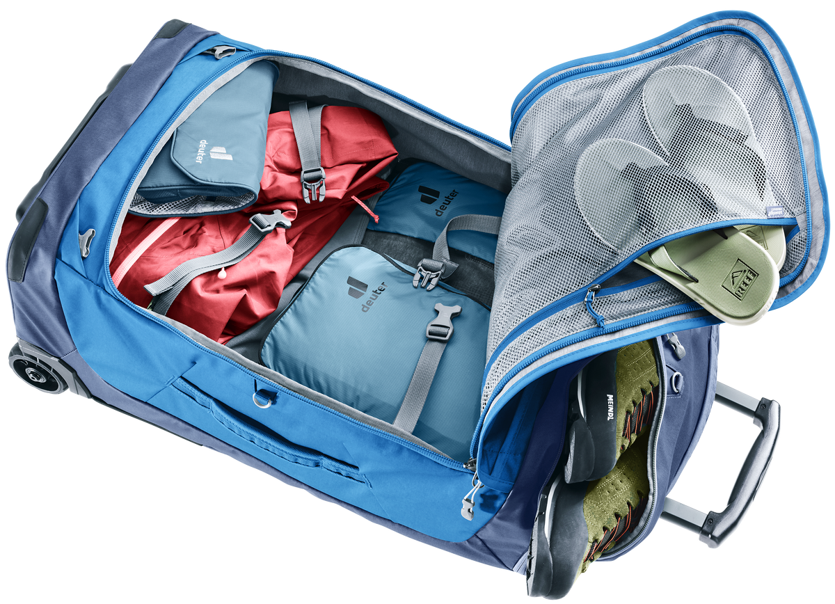 Deuter Duffel Pro Movo 60 laid open and packed, showing inner mesh and zipped compartments
