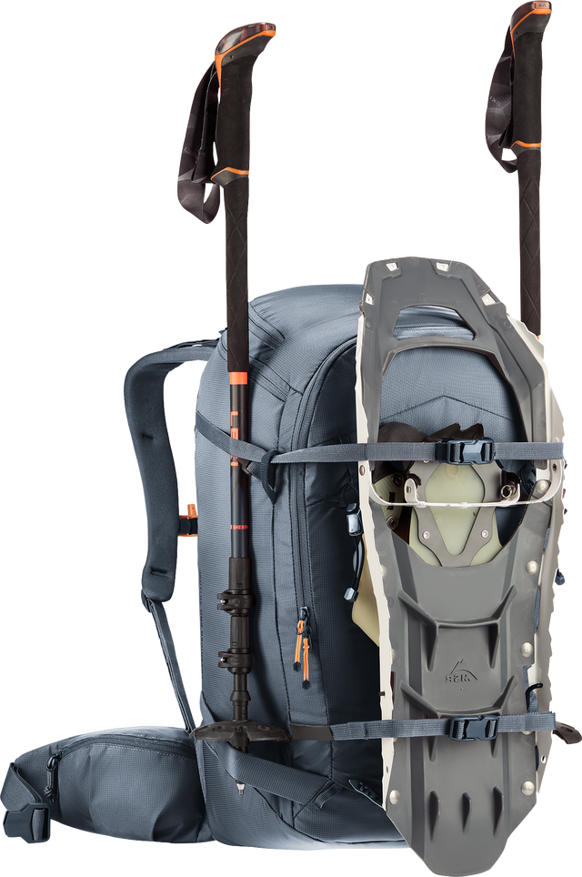 Deuter Freerider Pro 30+10 SL carrying snowshoes on the front and poles at the sides