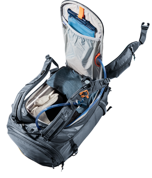 Deuter Freerider Pro 30+10 SL rear panel open showing a hydration bladder and packed main compartment