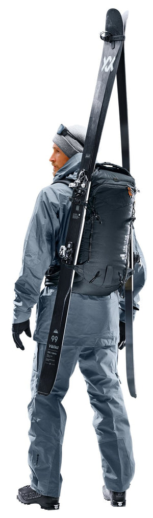 Ski tourer from behind with skis carried A-frame on the Deuter Freescape Lite 26