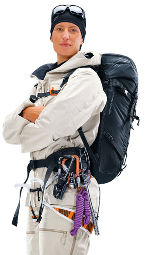 Ski mountaineer wearing the Deuter Freescape Tour 30 SL over a harness with gear on the hip fin