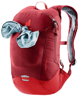 Deuter Junior Bike with a jacket stuffed in the stretch mesh front pocket