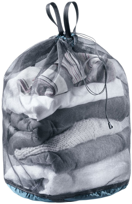 Deuter Mesh Sack 10 in Atlantic Black filled with folded clothes, drawcord closed