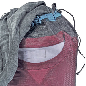Close-up of the Deuter Mesh Sack 10 drawcord top with a jumper and shirt inside