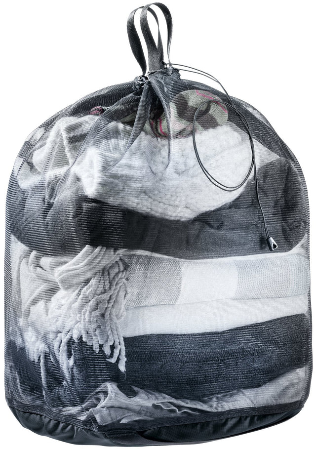 Deuter Mesh Sack 18 in black, drawn closed and filled with folded clothes