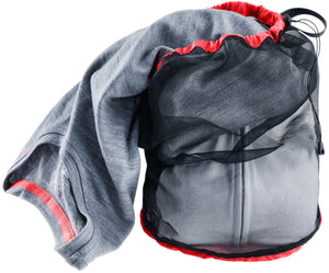 Deuter Mesh Sack 5 with a grey fleece being packed through the drawcord opening