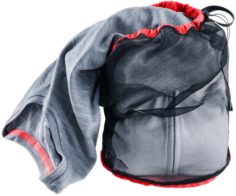 Deuter Mesh Sack 5 with a grey fleece being packed through the drawcord opening