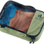 Deuter Mesh Zip Pack 1 in Grove green, closed, with folded clothes visible through the mesh top