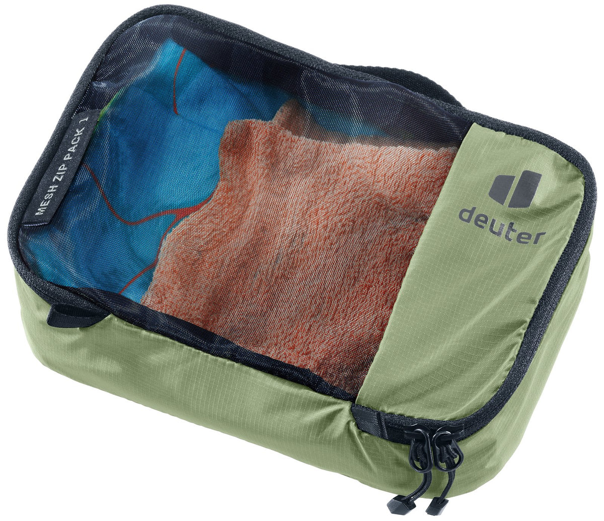 Deuter Mesh Zip Pack 1 in Grove green, closed, with folded clothes visible through the mesh top