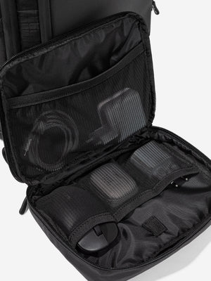 Inside the Orca Casual Backpack: mesh zip pockets holding a mouse and cables