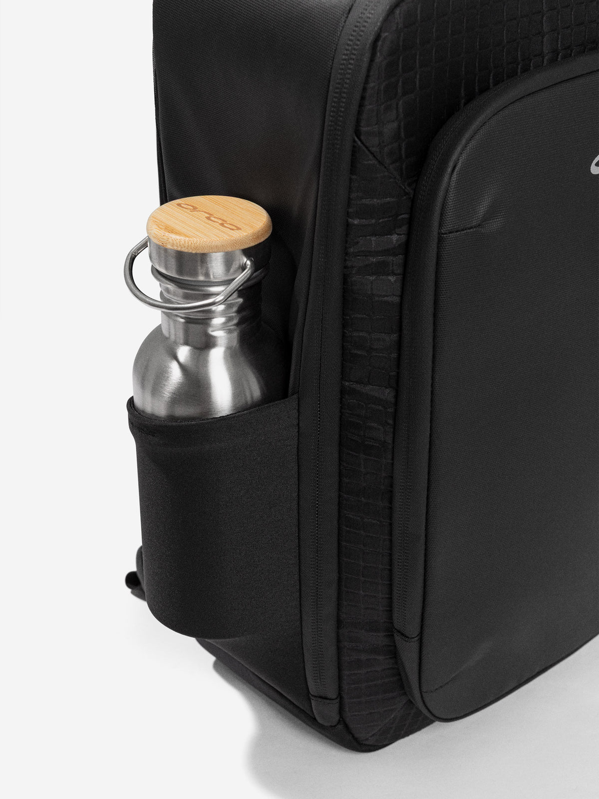Side pocket of the Orca Casual Backpack holding a steel drink bottle