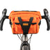 Restrap Bar Pack in orange mounted on drop handlebars, front view