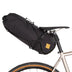 Restrap Saddle Bag 14 L with black cordage mounted on a bike with tan-wall tyres