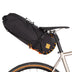 Restrap Saddle Bag 14 L with orange cordage mounted on a bike with tan-wall tyres