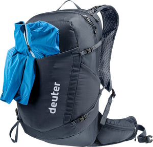 Deuter Speed Lite Pro 17 SL with a blue jacket stuffed in the mesh front pocket