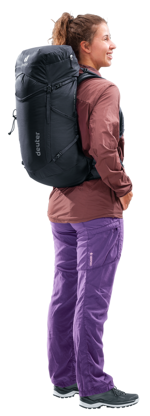 Woman wearing the Deuter Speed Lite Pro 28 SL, side view showing the fit