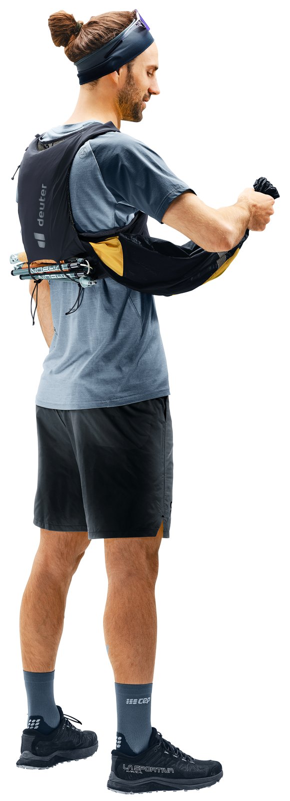Side view of a runner wearing the Deuter Traick 9, reaching into the side access